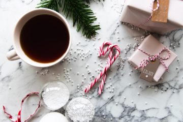 Cup of hot cocoa and candycanes on a table